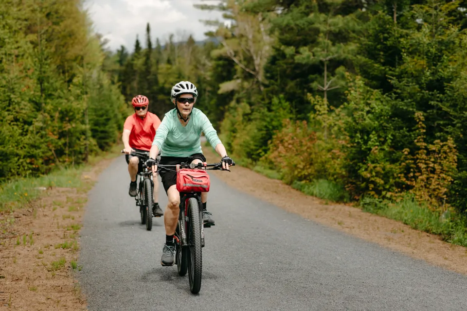 Two people riding bikes on Adirondack Rail Trail